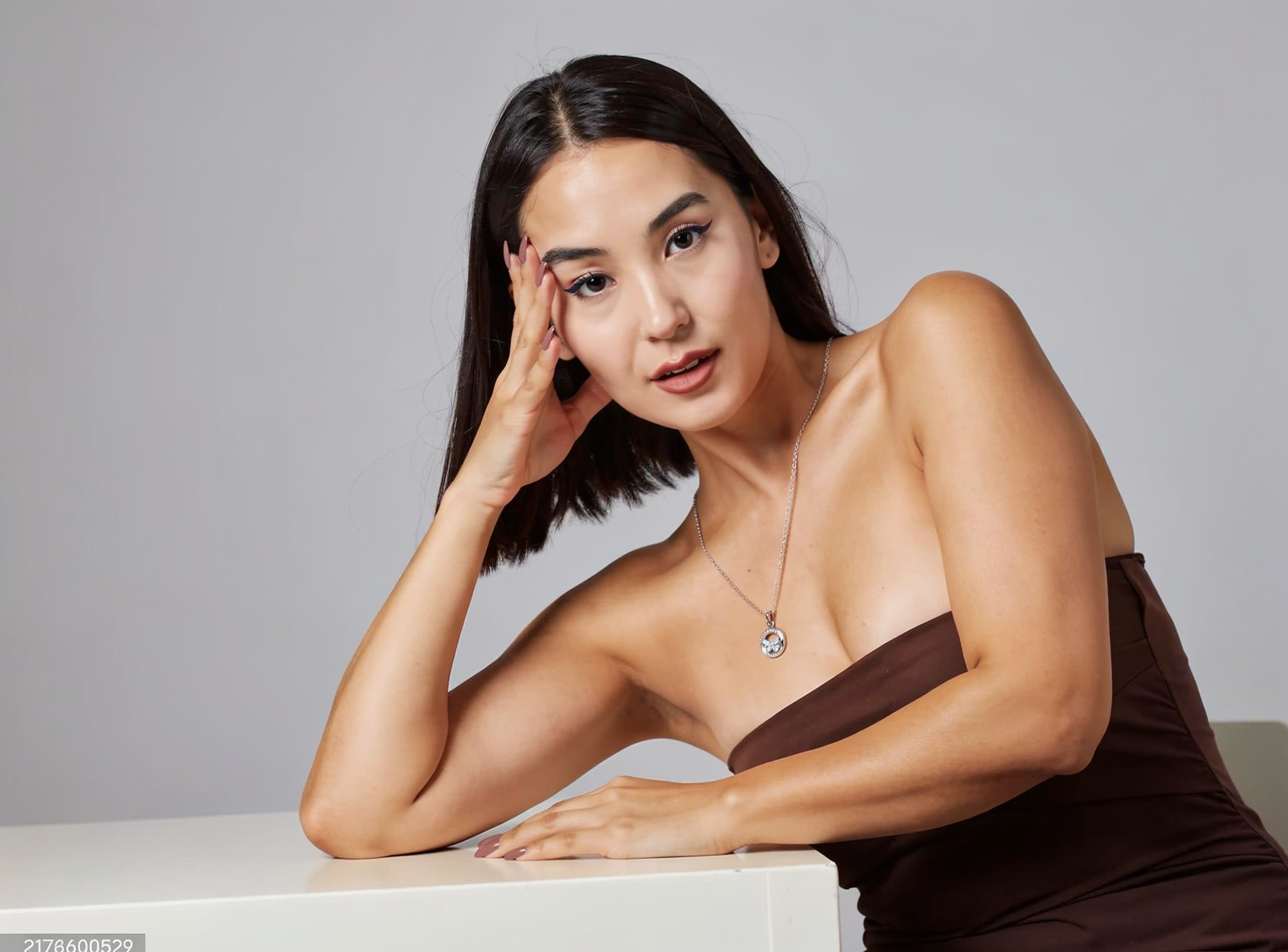 KREMO jewelry presented in a refined editorial composition